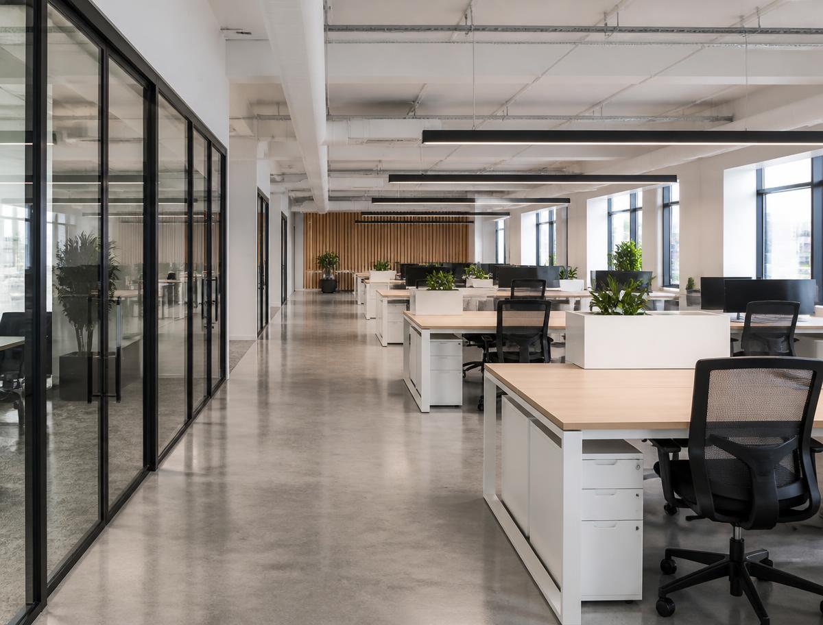Clean modern open plan office with polished floors after commercial cleaning